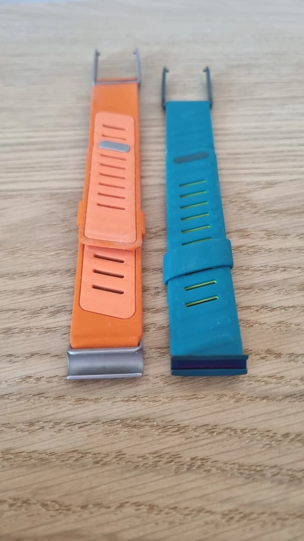 Aligning the WHOOP 4.0 to 5.0/MG band adapter horizontally with the clasp slot